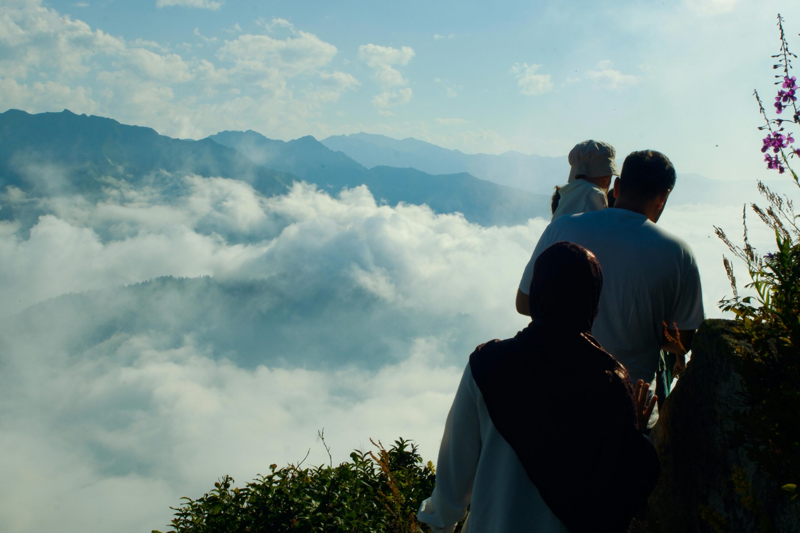 Family hiking adventure with breathtaking mountain views above the clouds. Perfect blend of nature and togetherness.